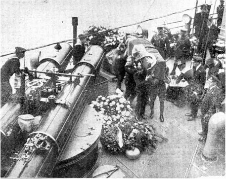The Unknown Warrior arrives in Dover. The coffin being removed from HMS Verdun by soldiers, a sailor and an airman.