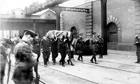 The Unknown Warrior arrives in Dover. The coffin being carried along the guayside at the Admiralty Pier.