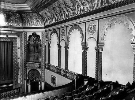 The Granada Cinema auditorium c.1930.  The side wall and part of the stage seen from the balcony.  The pipes for the organ were behind the decorative grille to the right of the stage.