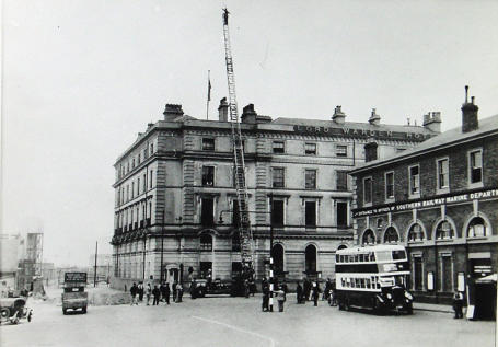 The Lord Warden Hotel, May 1937.  The hotel is not on fire, the fire brigade is trying out their new ladder.  The old Town Station can be seen on the right.